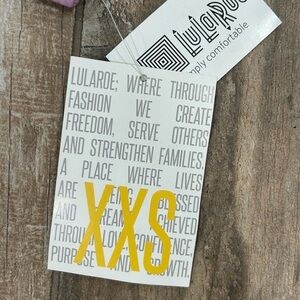 LuLaRoe Ghost Print Top in Teal, Orange, Purple